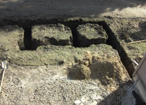Construction on a large stone outdoor living space