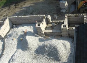 Construction on a large stone outdoor living space