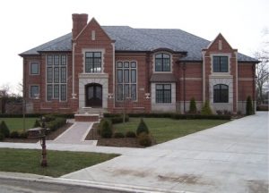 decorative cement driveway, brick walkway and steps