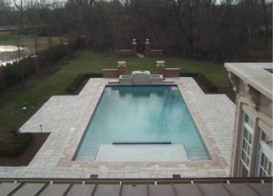 large stone walkways around a swimming pool