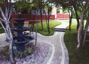 decorative brick walking paths and water feature