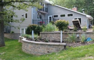 large home and yard with 2 retaining walls